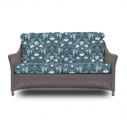 sofá de ratán de diseño con textiles estampados esclusivos para jardín