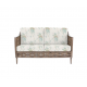 sofá para jardín en ratán color roble con cojines estampados de diseño